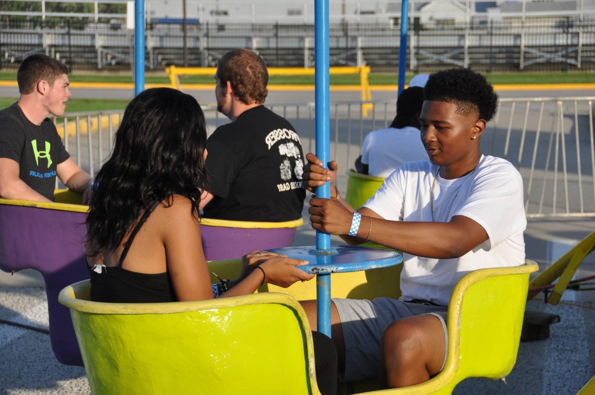 students in carnival/fair ride